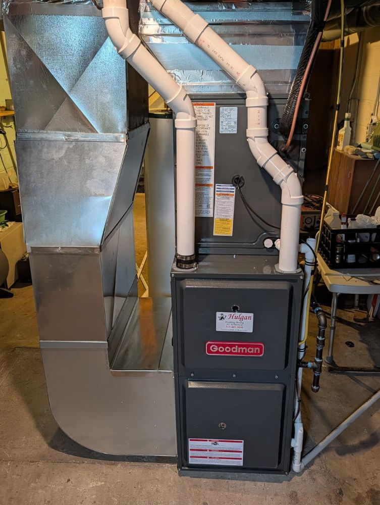 Clean new high-efficiency furnace install by Hulgan Plumbing & Heating in Perry, Iowa