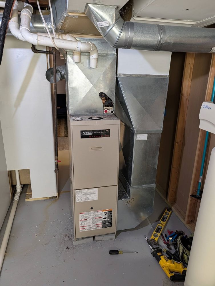 Old furnace before replacement by Hulgan Plumbing & Heating in Perry, IA