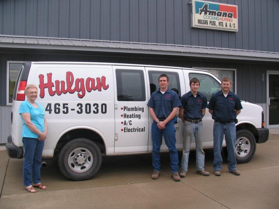 Hulgan Plumbing & Heating service van and crew outside the shop in Perry, Iowa